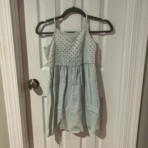 Light blue dress with diamond holes around the top
